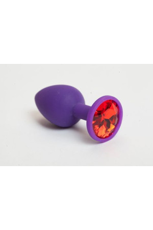Фиолетовая силиконовая анальная пробка с красным стразом - 7,1 см.